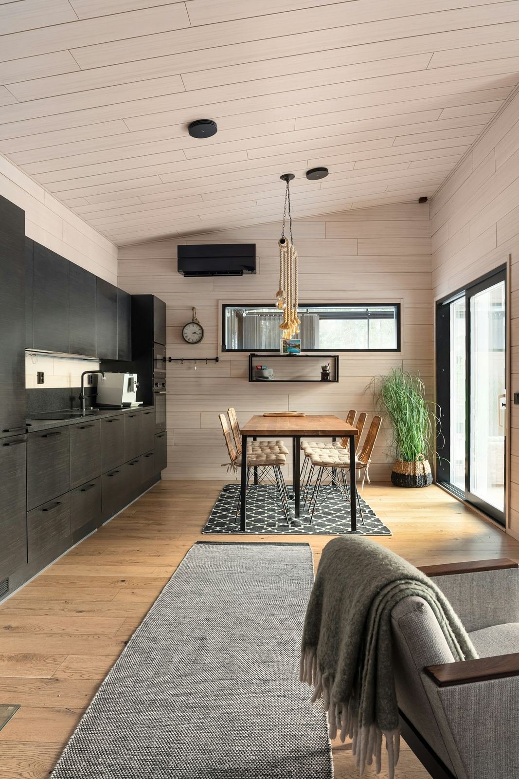 Bright modular interior with wood floors and kitchen